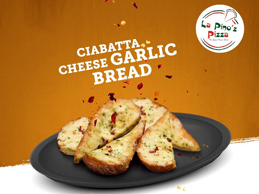 "🧀🍞🌟 Indulge in Ciabatta Cheese Garlic Bread at La Pino'z